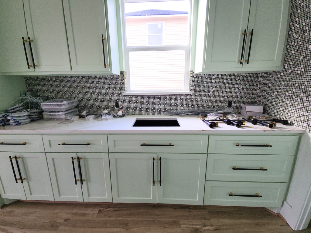 Luxury home remodeling Houston custom sage kitchen installation in progress by Square 1 Home Solutions